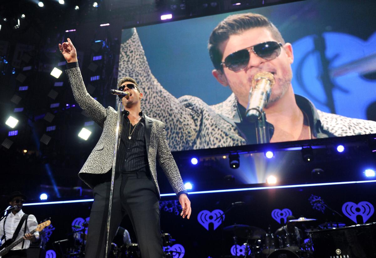 Robin Thicke performs at Z100's Jingle Ball 2013 at Madison Square Garden on Friday in New York.