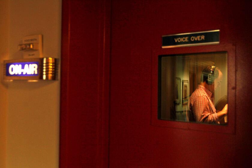 Ross Mackenzie does voice-over work at KCRW. For years, the station has been housed in cramped quarters in a basement.
