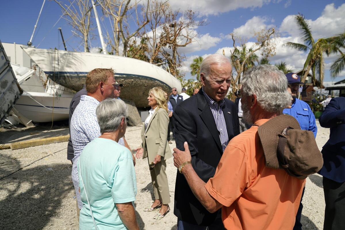 President Biden and First Lady Jill Biden talk to people in Florida.
