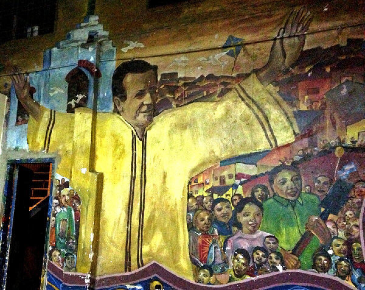 A mural in one of Buenos Aires' shantytowns, where "slum priests" have worked for decades, combating poverty, drug addiction and homelessness. The priests now have the support from the highest ranks of the Catholic Church. Jorge Mario Bergoglio, who served as archbishop of Buenos Aires for 15 years before taking the title of Pope Francis earlier this year, made the slum priests a priority. He tripled their numbers, opened new chapels and visited frequently, usually arriving on his own by city bus.