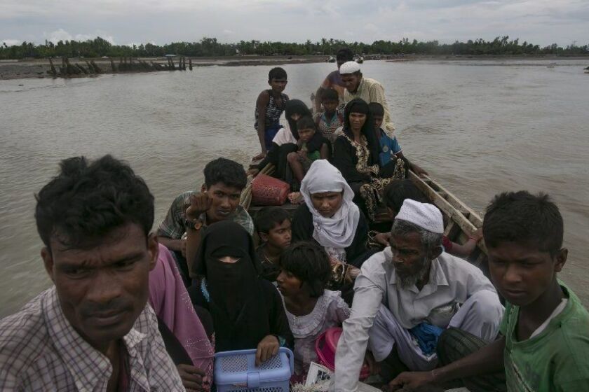 SHAH PORIR DWIP, BANGLADESH - SEPTEMBER 17: Rohingya refugees cross into the mainland after arriving in Bangladesh on September 17, 2017 in Shah Porir Dwip Bangladesh. Nearly 400,000 Rohingya refugees have fled into Bangladesh since late August during the outbreak of violence in the Rakhine state as recent satellite images released by Amnesty International provided evidence that security forces were trying to push the minority Muslim group out of the country. Myanmar's de facto leader Aung San Suu Kyi cancelled her trip to the United Nations General Assembly in New York, which begins next week, while criticism on her handling of the Rohingya crisis grows and her government has been accused of ethnic cleansing. According to reports, the Rohingya crisis has left at least 1,000 people dead, including children and infants, with dozens of the Rohingya Muslims who drowned when their boat capsized while trying to escape on overloaded fishing boats ill-equipped for rough waters. (Photo by Allison Joyce/Getty Images) ** OUTS - ELSENT, FPG, CM - OUTS * NM, PH, VA if sourced by CT, LA or MoD **