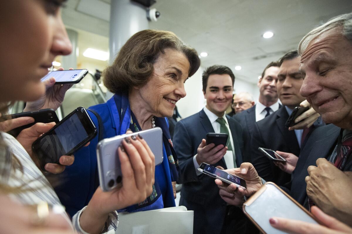 California Sen. Dianne Feinstein talks to reporters in the Capitol on Tuesday.