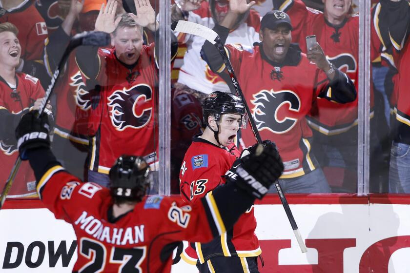 Calgary forward Johnny Gaudreau celebrates after scoring the game-tying goal in the third period to force overtime. The Flames beat the Ducks, 4-3, in overtime.