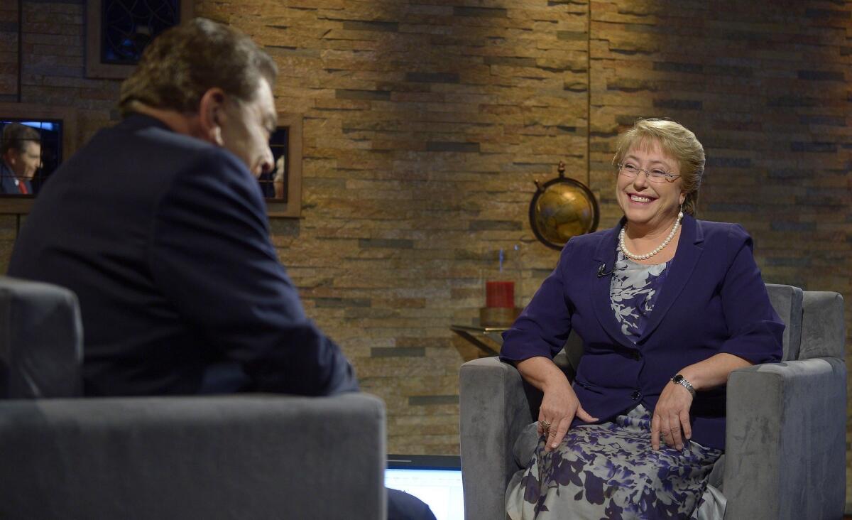 Chile's President Michelle Bachelet speaks with TV showman Mario Kreutzberger, better known as Don Francisco, during a telecast interview on May 6.