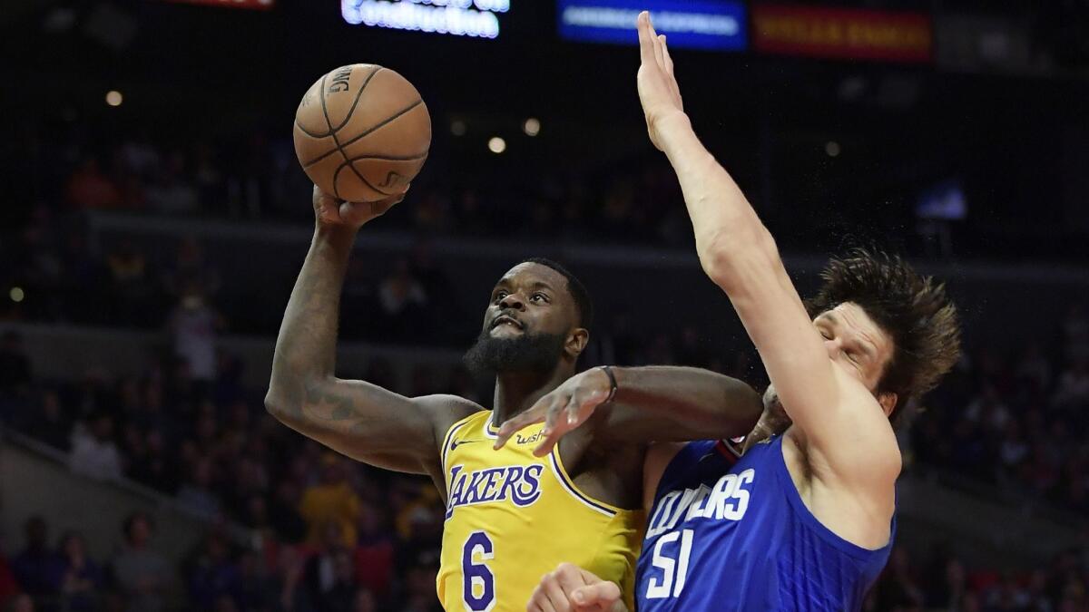 Lakers guard Lance Stephenson elevates past Clippers center Boban Marjanovic, elbow and all, for a layup during the second half Thursday.