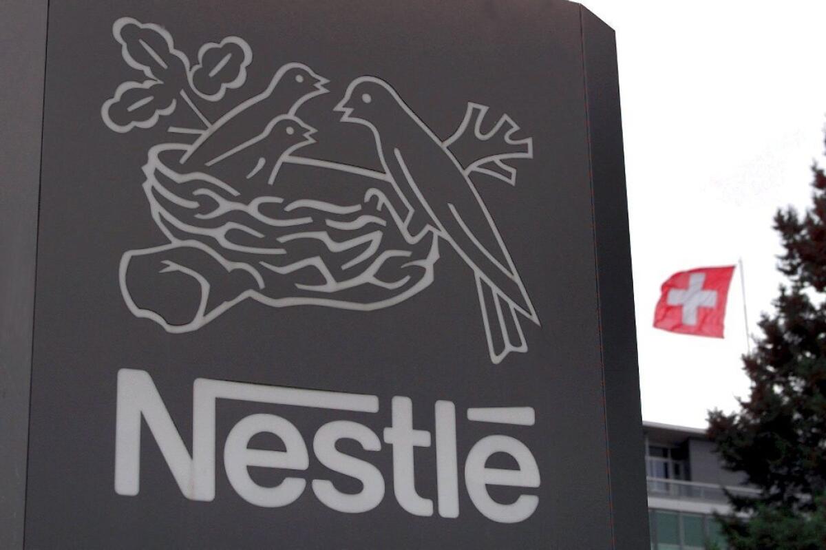 Nestle will require suppliers to provide more space for farm animals, minimize pain in veterinary practices and welcome independent auditors. Above, Nestle world headquarters in Vevey, Switzerland.