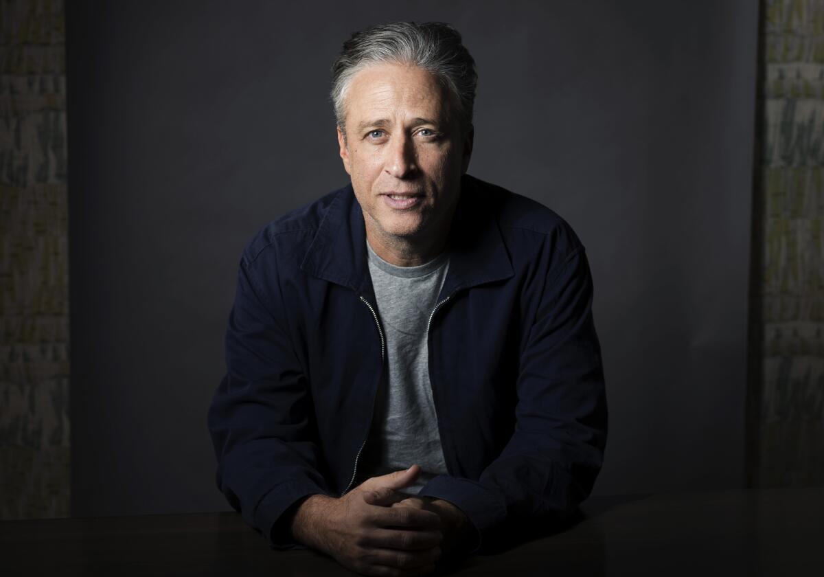 Jon Stewart performing live on tour in 2025