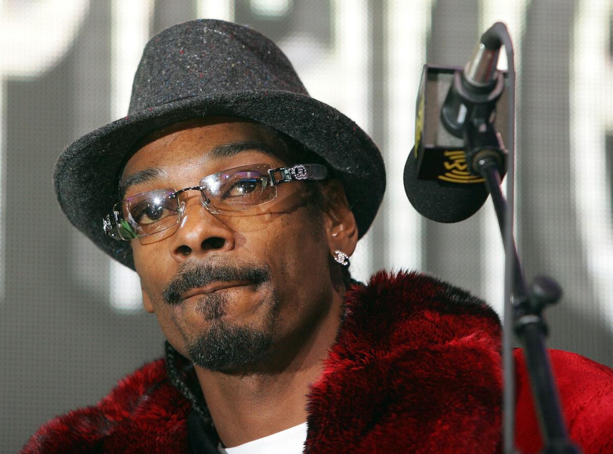 Snoop Dogg is interviewed at the XM Satellite Radio booth at the International Consumer Electronics Show in Las Vegas on Jan. 5, 2006.