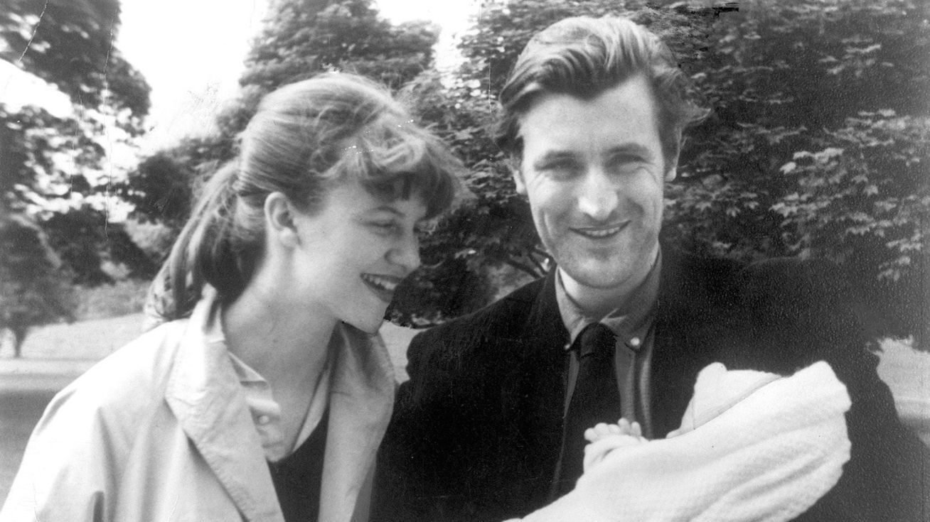 Ted Hughes and Sylvia Plath holding their child