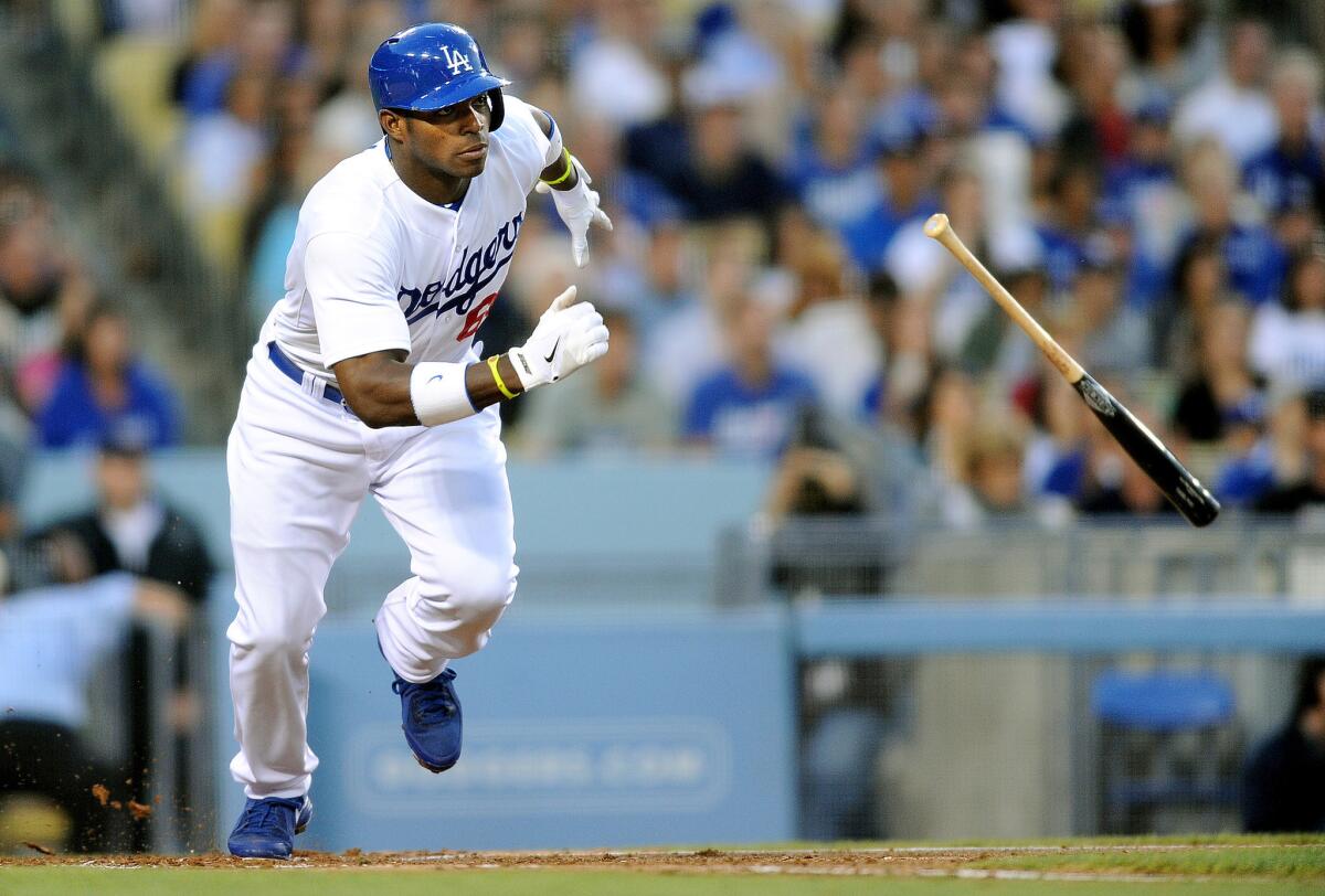 Dodgers' Yasiel Puig singles in the third inning against the Braves on Saturday at Dodger Stadium.