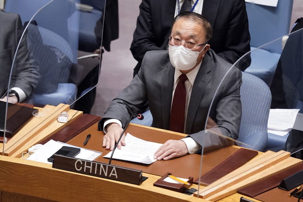 China's U.N. Ambassador Zhang Jun addresses the United Nations Security Council, Monday, Jan. 31, 2022. (AP Photo/Richard Drew)