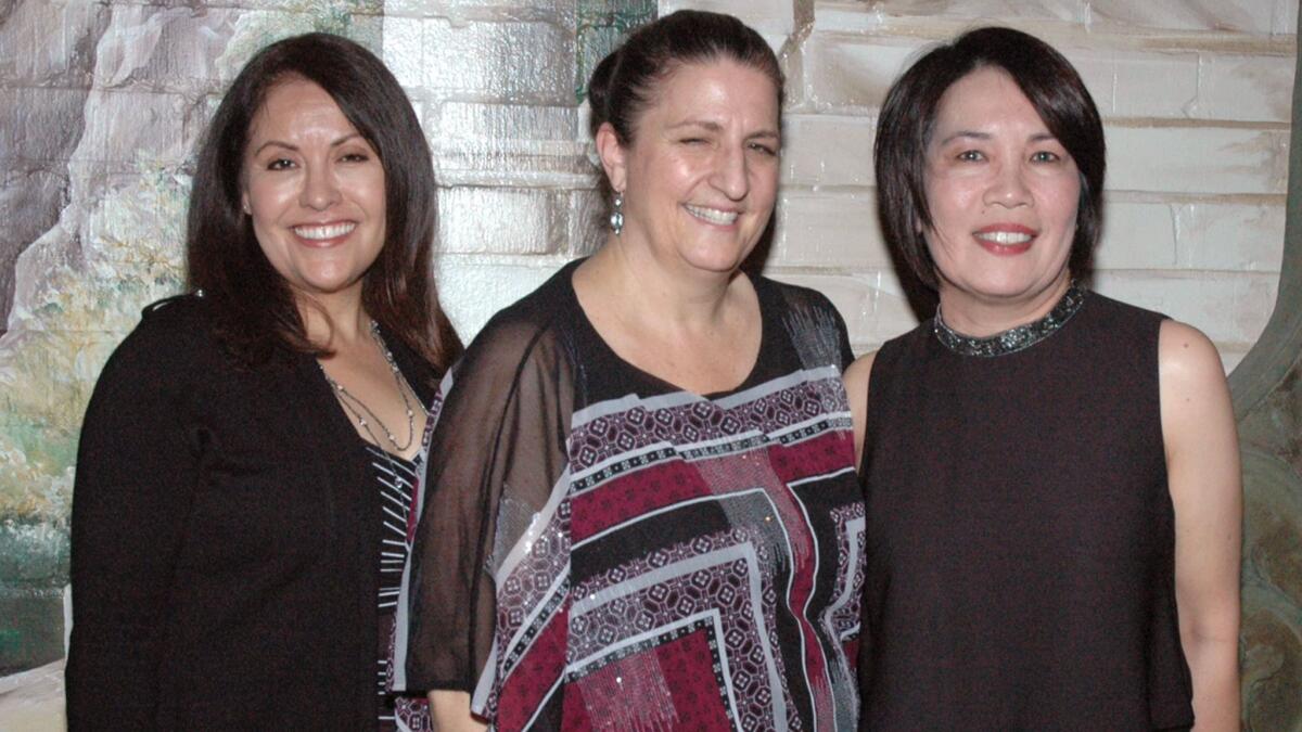 Gathering together at the "Raising a Glass" open house are National Charity League leaders, from left, Auction Chair Fabiola Garcia, President Cheryl Kisob and Fundraising Event Chair Charo Dolendo.