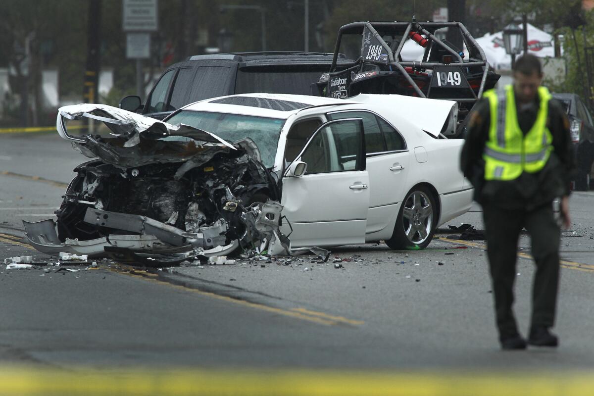 Los Angeles County Sheriff's deputies investigate the scene of a four-vehicle crash in Malibu on Saturday. Officials have confirmed that former Olympian Bruce Jenner was involved in the crash.