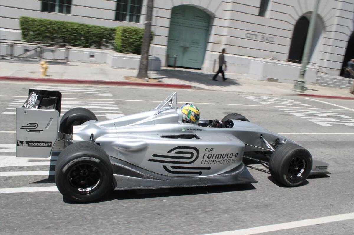 Driver Lucas Di Grassi drives the new Formula E electric race car prototype April 22 in Los Angeles.