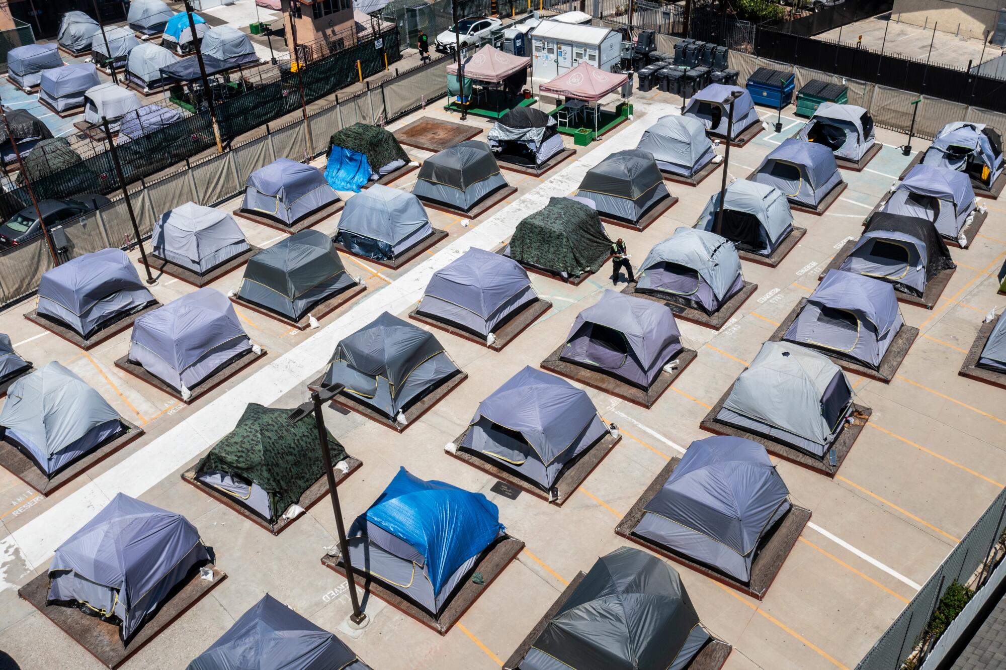 An aerial view of tents neatly lined in rows