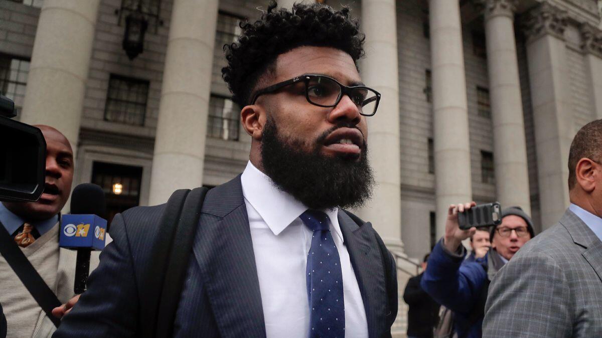 Dallas Cowboys' Ezekiel Elliott walks out of federal court in New York on Nov. 9. Elliott has dropped his appeal on Wednesday with five games remaining on his six-game suspension over alleged domestic violence.