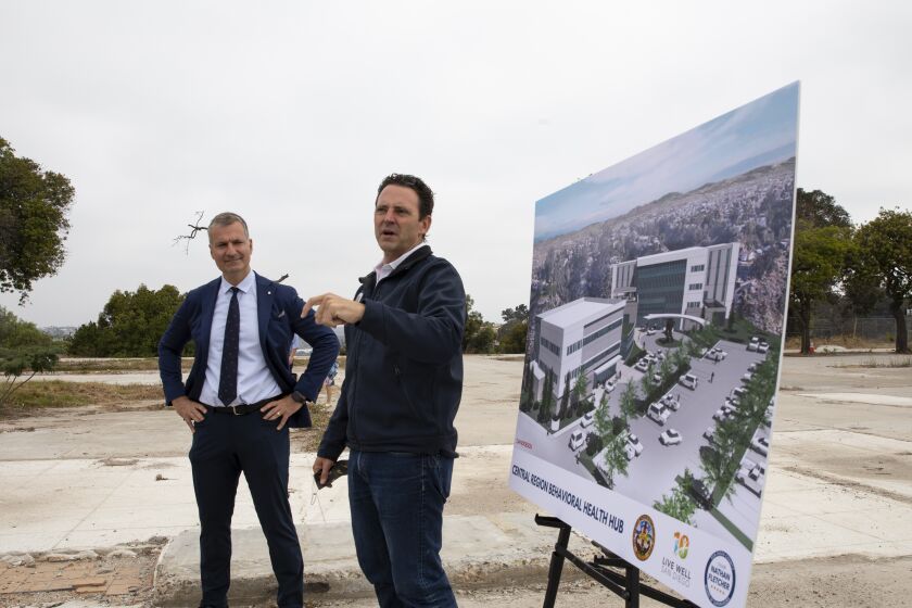 San Diego, California - September 03: Chair Nathan Fletcher, Supervisor of San Diego County's Fourth District, right, and Dr. Zafiris J. Daskalakis give a presentation at a site that will be the new Central Region Hub. (Ana Ramirez / The San Diego Union-Tribune)