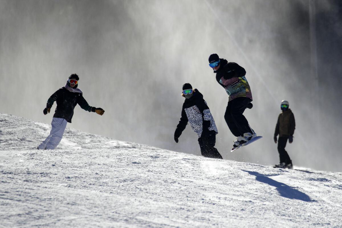Skiers and snow boarders at Mountain High.