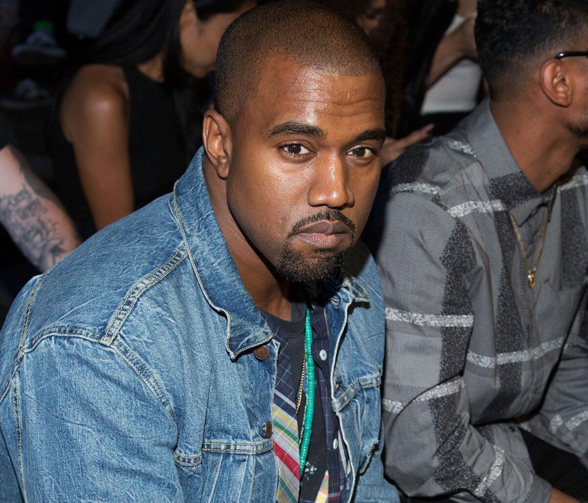 Kanye West, seen here at a New York fashion show earlier in the month, has recently put L.A. Times writer Chris Lee in his Twitter cross hairs.