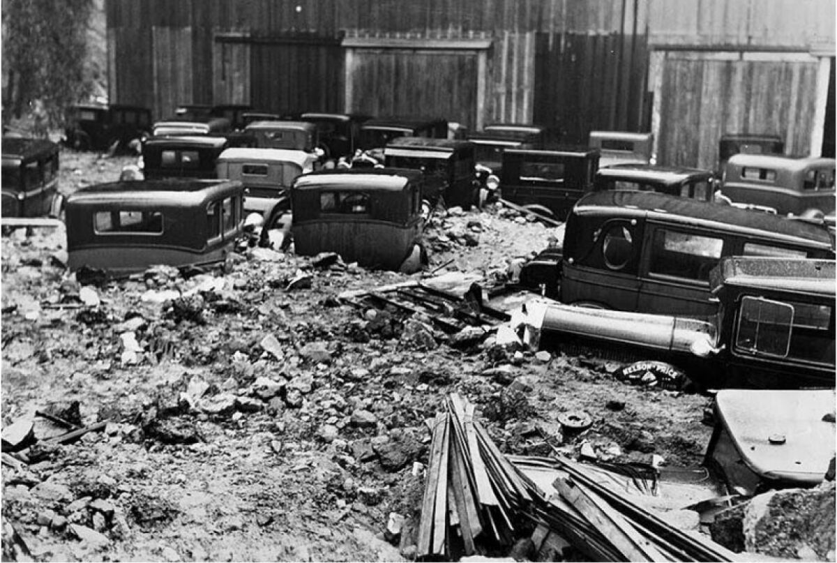 After the 1934 New Year's flood in Los Angeles, cars are marooned in mud outside the Bohemian Gardens.