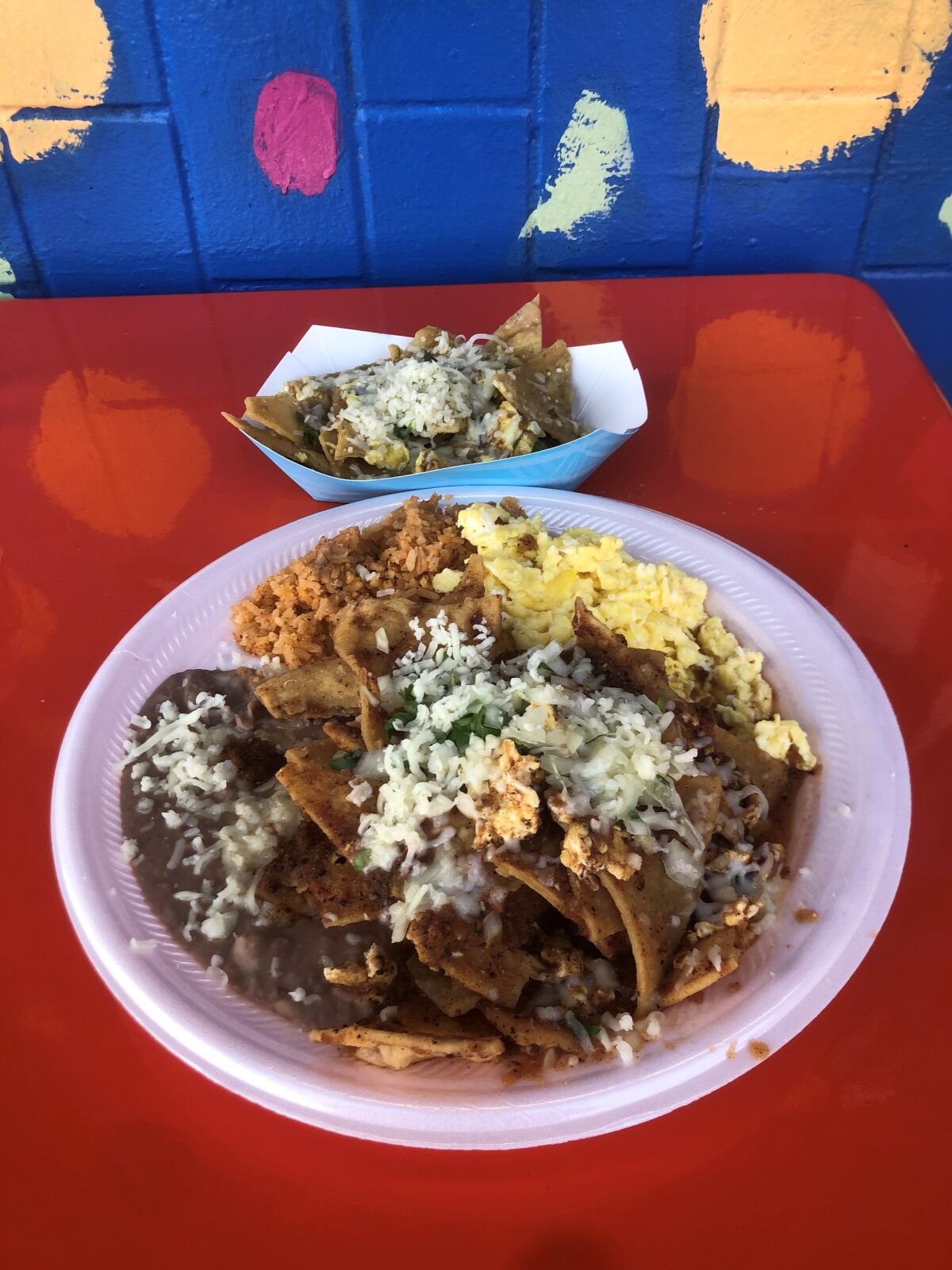 Tacos Delta's chilaquiles two ways: red and green.