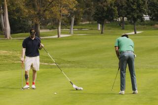 Los Angeles, CA - March 15: Rob Knoplfler (left) and James Fahselt (right) make their final putts at the Wilson Golf Course on Friday, March 15, 2024 in Los Angeles, CA. (Carlin Stiehl / For The Times)