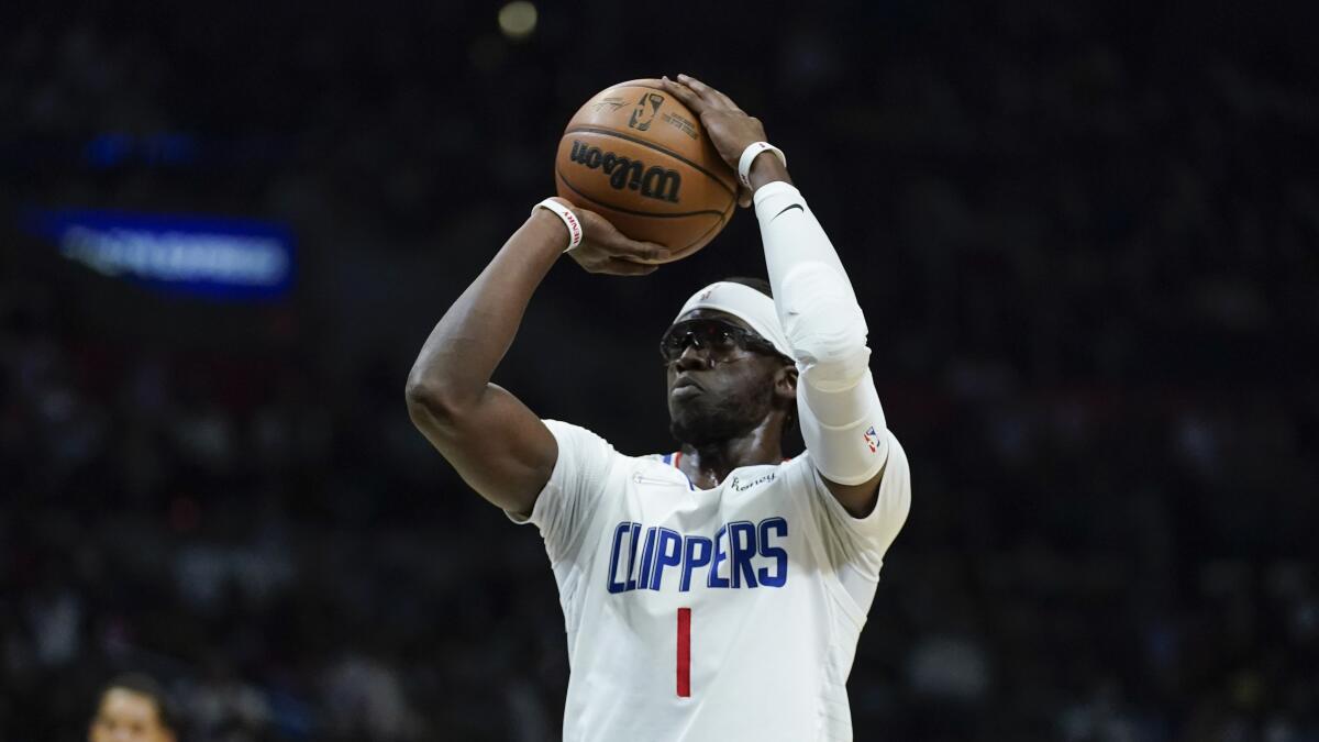Clippers guard Reggie Jackson shoots against the Golden State Warriors on Nov. 28, 2021.