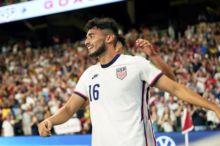 United States' Ricardo Pepi (16) celebrates with teammates after scoring his second goal against Jamaica.