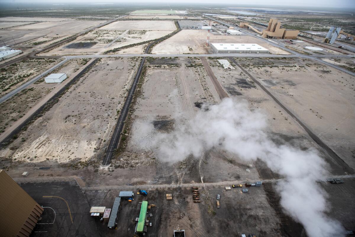 Empty landscape surrounding a power plant.