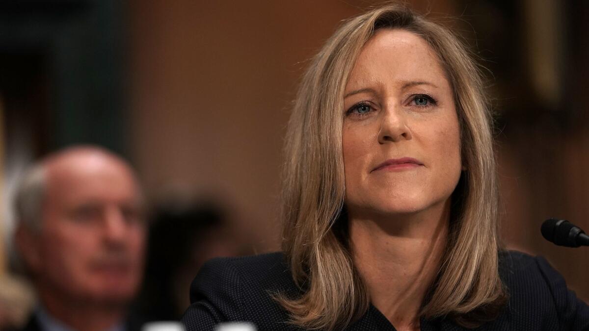 Kathy Kraninger, President Trump's nominee to head the Consumer Financial Protection Bureau, testifies during her Senate Banking Committee confirmation hearing in July.