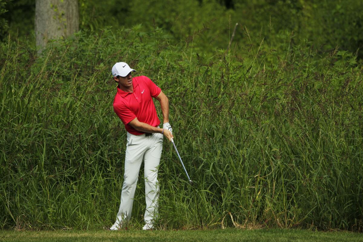 Rory McIlroy shoots on the 17th hole during the first round of the Barclays on Thursday.