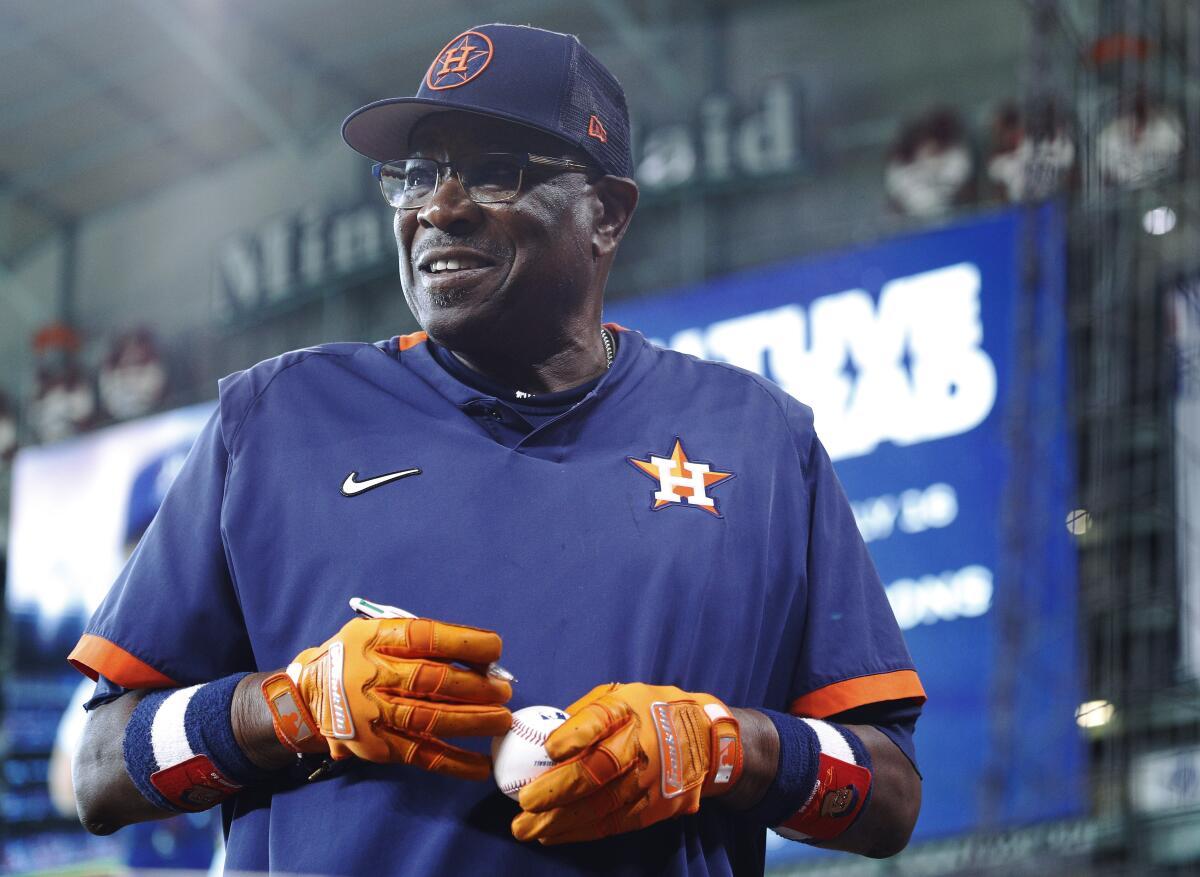 Houston Astros manager Dusty Baker Jr. signs autographs before the team's baseball game against the Kansas City Royals on Tuesday, July 5, 2022, in Houston. (AP Photo/Kevin M. Cox)