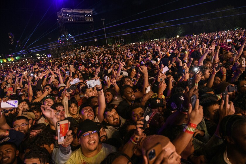 The crowd watches as Travis Scott performs at Astroworld Festival at NRG park on Friday, Nov. 5, 2021 in Houston. Several people died and numerous others were injured in what officials described as a surge of the crowd at the music festival while Scott was performing. Officials declared a “mass casualty incident” just after 9 p.m. Friday during the festival where an estimated 50,000 people were in attendance, Houston Fire Chief Samuel Peña told reporters at a news conference. (Jamaal Ellis/Houston Chronicle via AP)