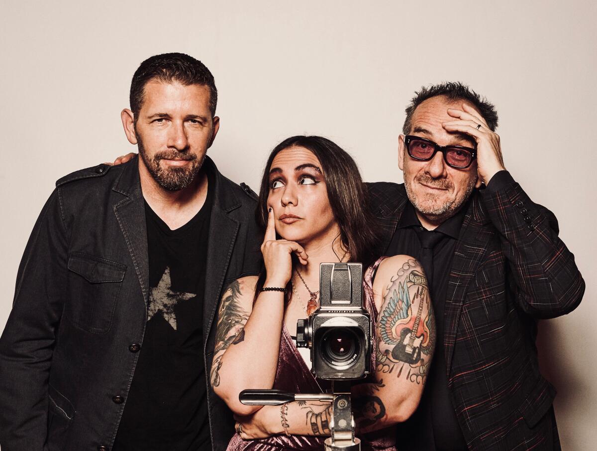 Elvis Costello, right, with Sebastian Krys, left, and Nina Diaz