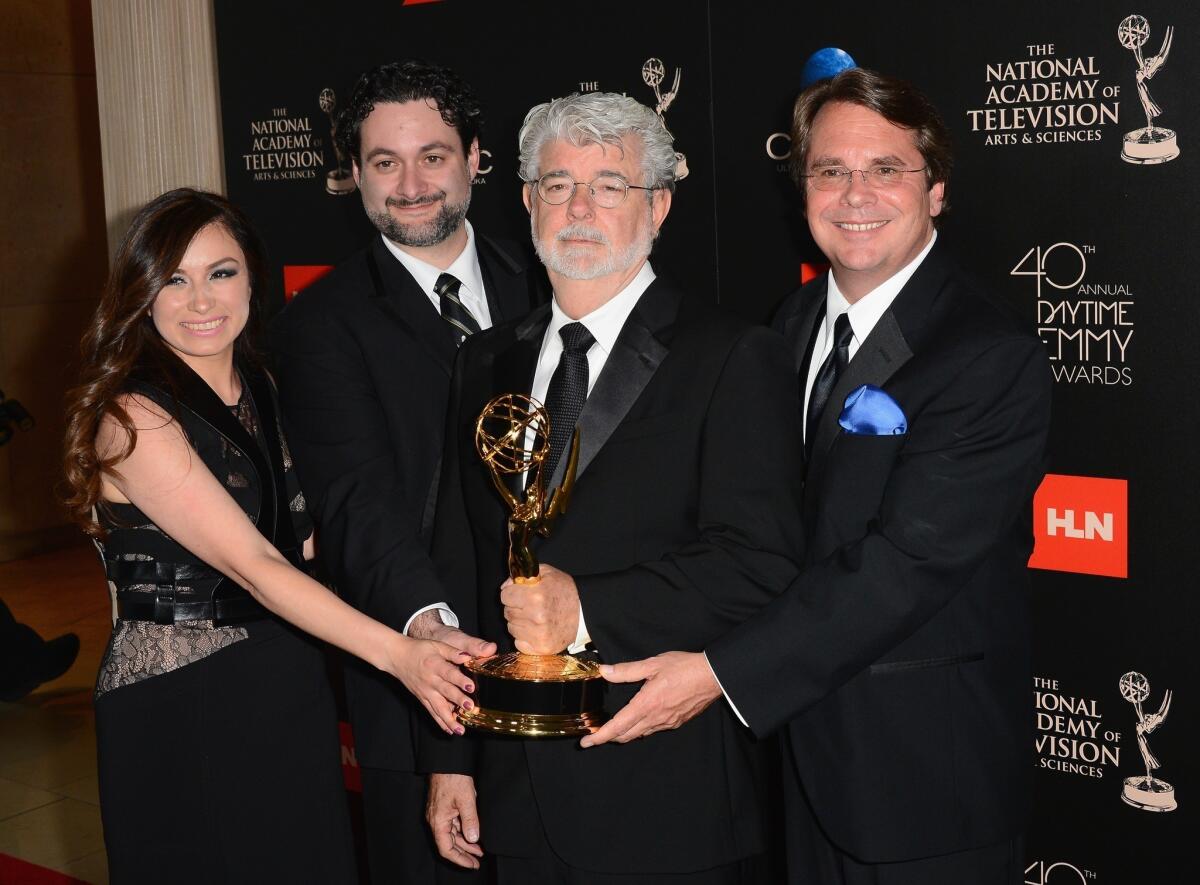 From left to right: Athena Portillo, Dave Filoni, George Lucas and Cary Silver pose with the Outstanding Special Class Animated Program award for "Star Wars: The Clone Wars" in the press room during The 40th Annual Daytime Emmy Awards.