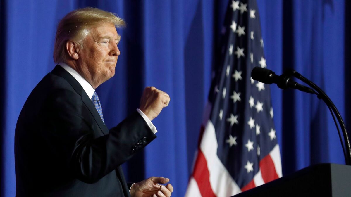 President Trump pumps his fist after concluding a speech about his tax proposal on Wednesday in Indianapolis.