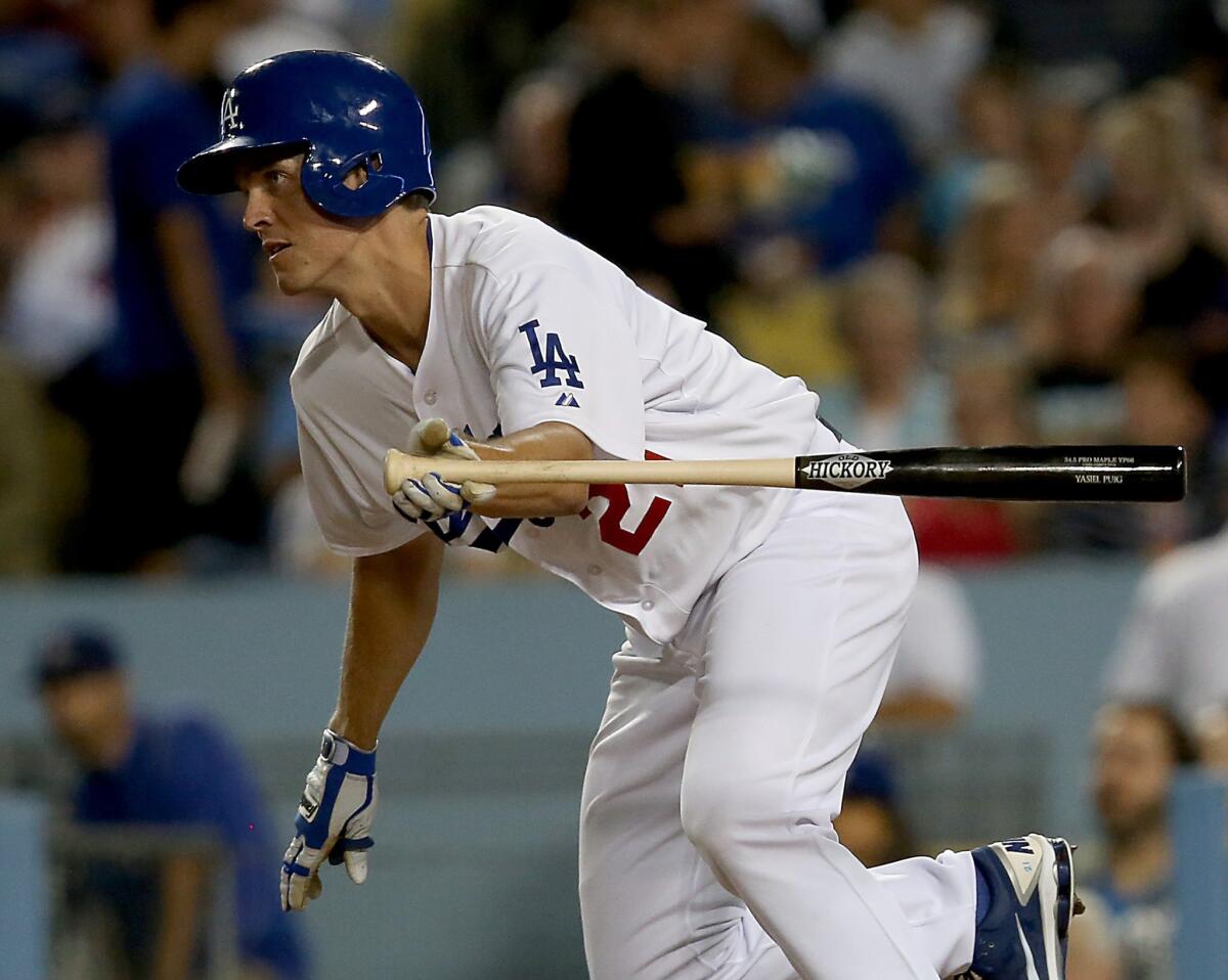 Dodgers pitcher Zack Greinke hits a run-scoring single during the fourth inning of the Dodgers' 6-2 win over the Chicago Cubs on Monday night.
