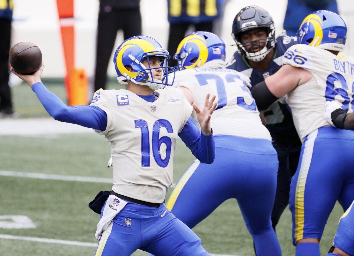 Jared Goff of the Rams looks to pass against the Seahawks during the first quarter of Saturday's game in Seattle.