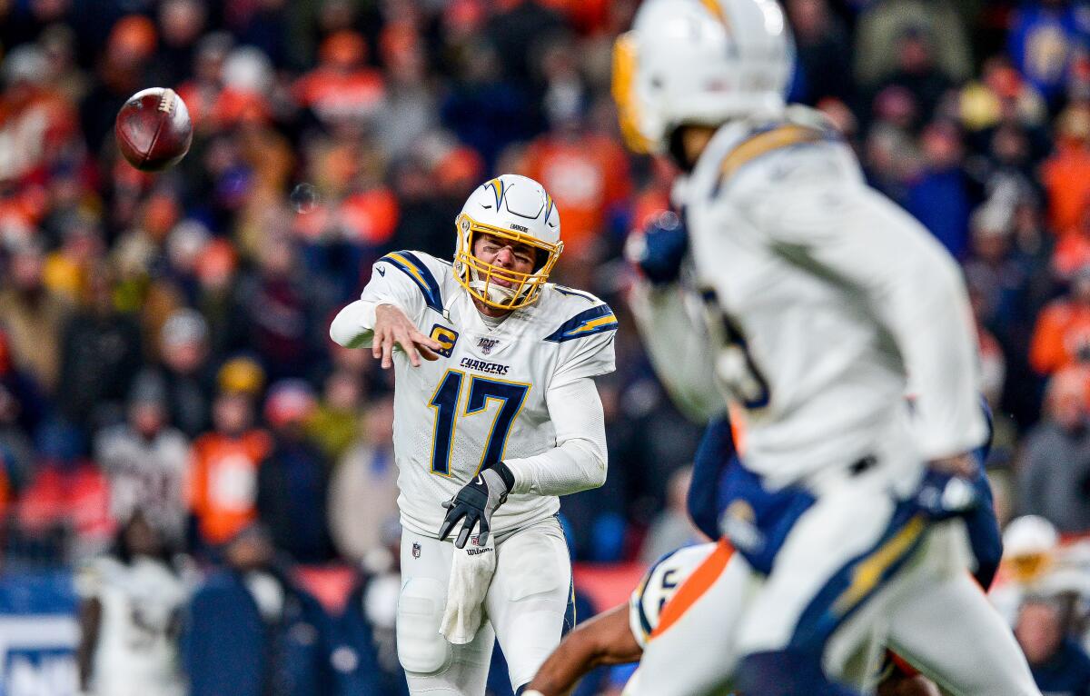 Chargers quarterback Philip Rivers completes a pass to Keenan Allen. 
