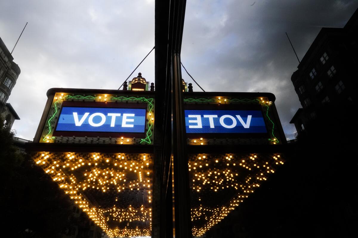 A marquee displays the word "vote."