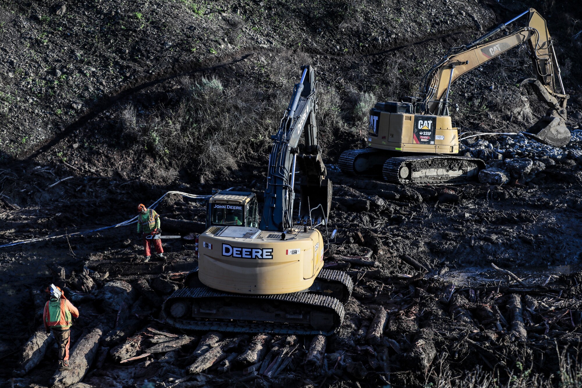 Workers and road equipment.