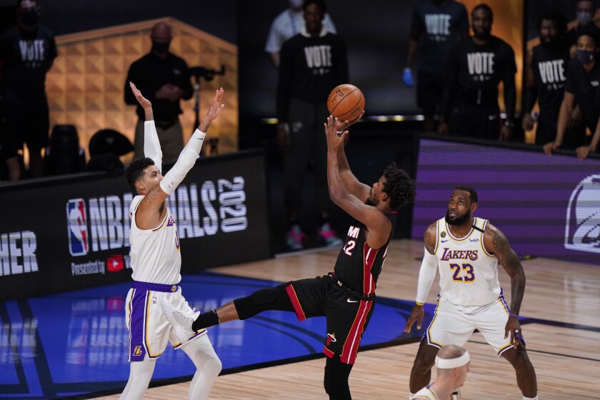 Heat guard Jimmy Butler attempts a fadeaway jumper over Lakers forward Kyle Kuzma during Game 3.