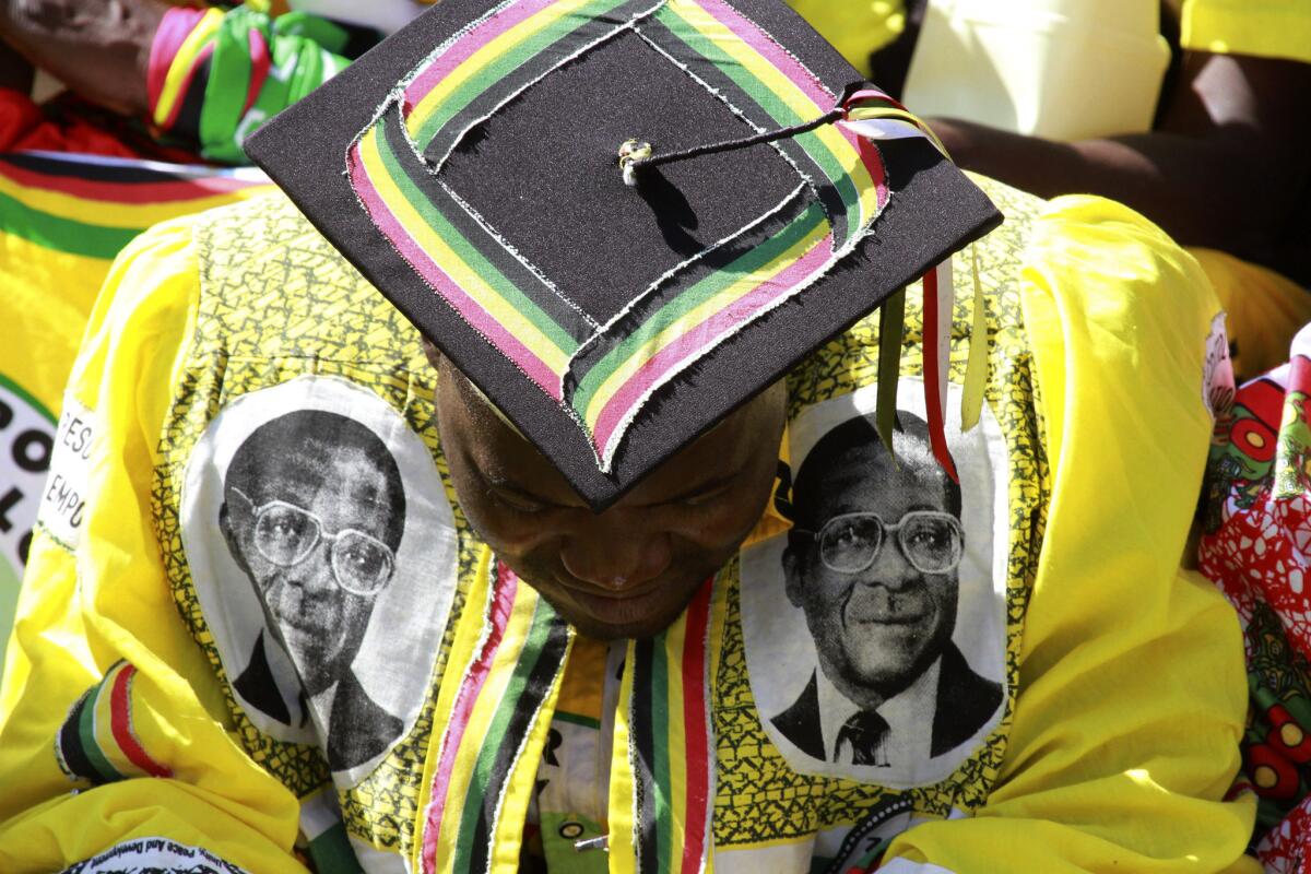 A supporter of Zimbabwean President Robert Mugabe attends his inauguration in Harare, the capital.