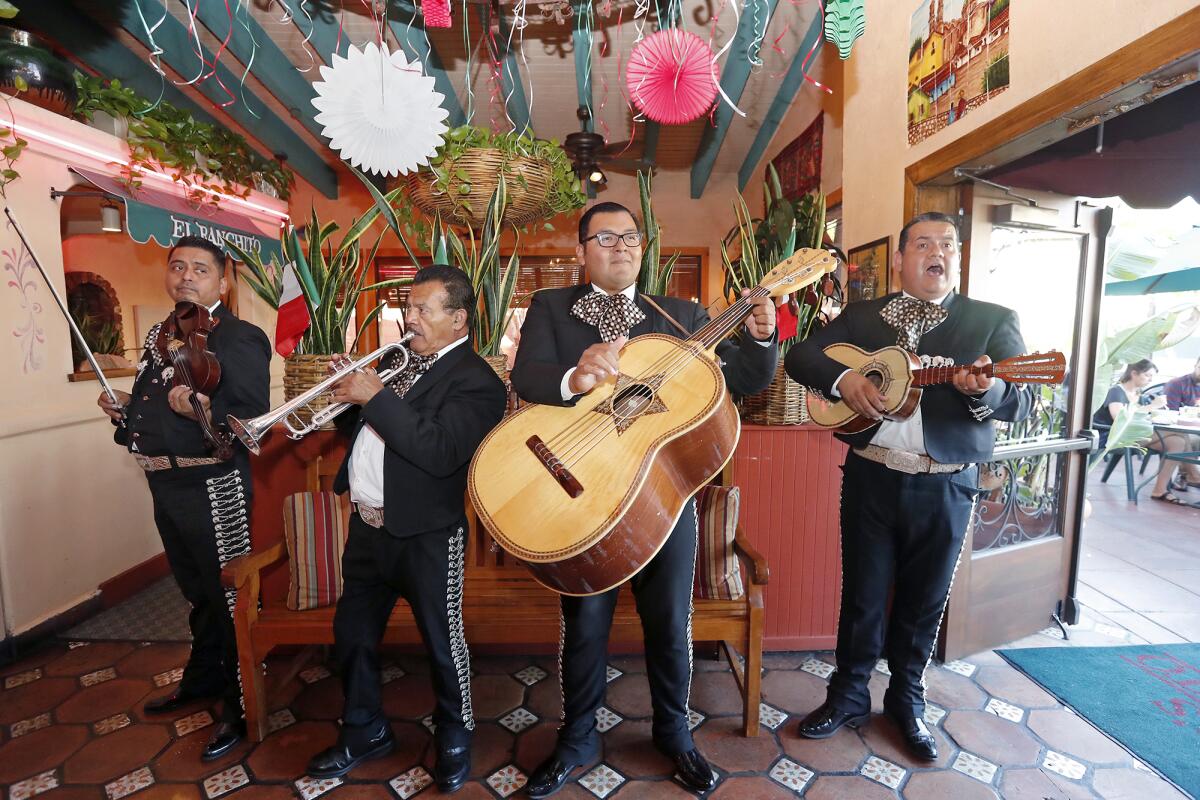 Mariachi San Martin performs during a celebration of National Hispanic Heritage Month at Avila’s El Ranchito in Costa Mesa on Wednesday.
