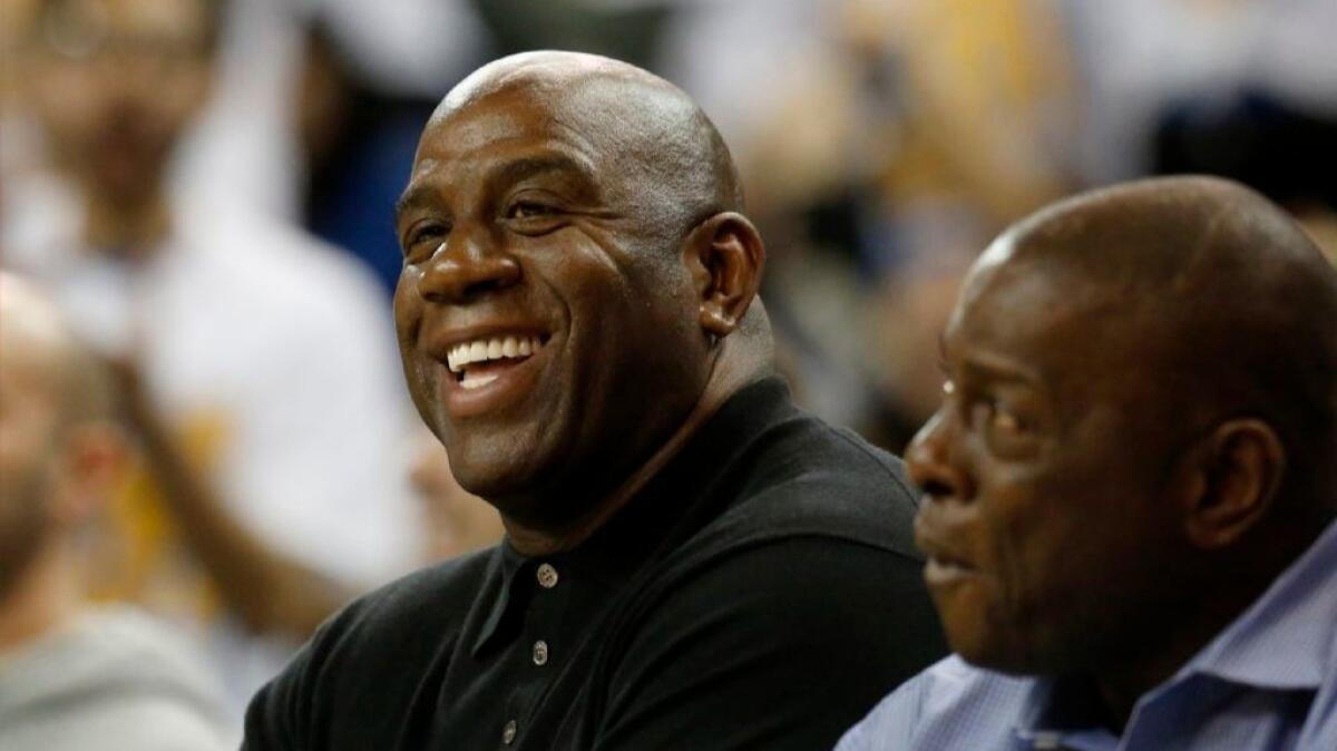 Lakers legend Magic Johnson attends a game between UCLA and Oregon at Pauley Pavilion on Feb. 9.