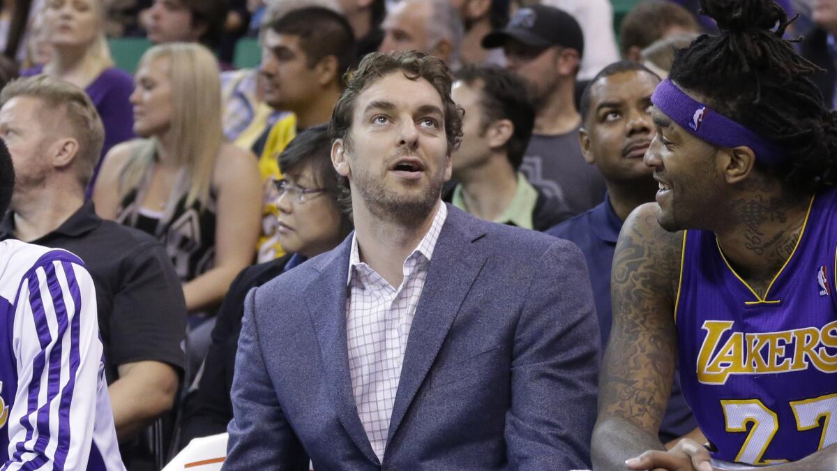 Lakers center Pau Gasol, left, speaks with teammate Jordan Hill on the bench during a game against the Utah Jazz in April.