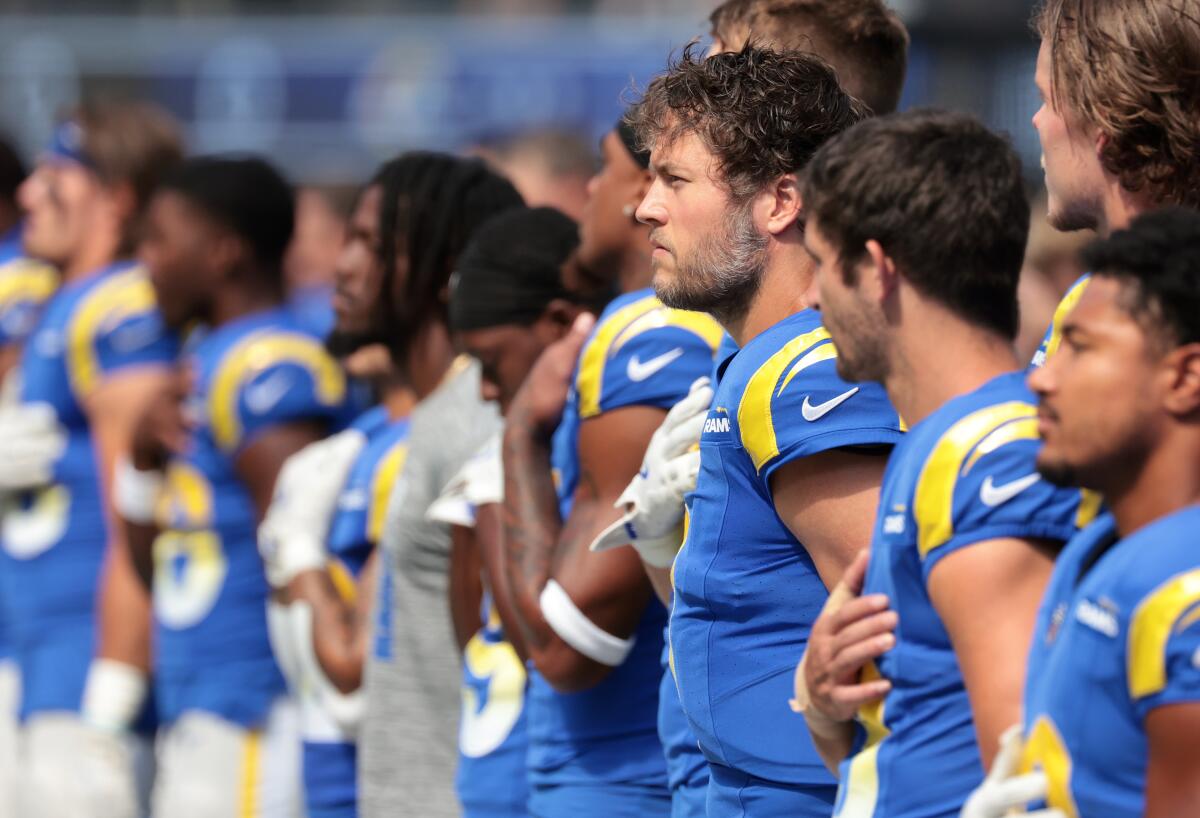 Rams quarterback Matthew Stafford listens to the national anthem with teammates before a loss to the Packers on Oct. 6.