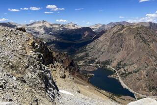 A view of Tioga Road snaking past Ellery Lake, taken from Dana Plateau in August 2022.