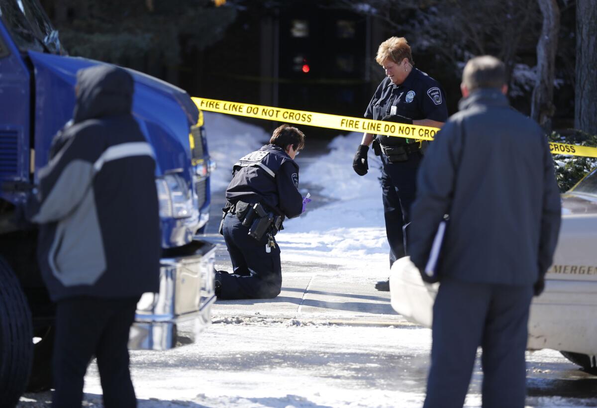 West Lafayette police gather evidence after a shooting about noon Tuesday in the electrical engineering building at Purdue University in West Lafayette, Ind. One person was killed in a classroom, and a suspect surrendered to police within minutes of the attack, officials said.
