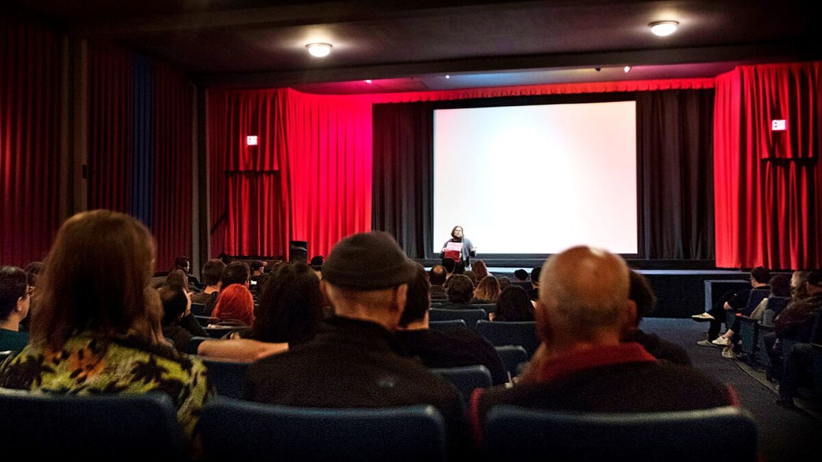 Theater manager Matt Dinan introduces a 35mm screening of "Pee Wee's Big Adventure."